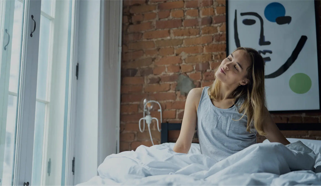 Girl waking up on an essentia mattress