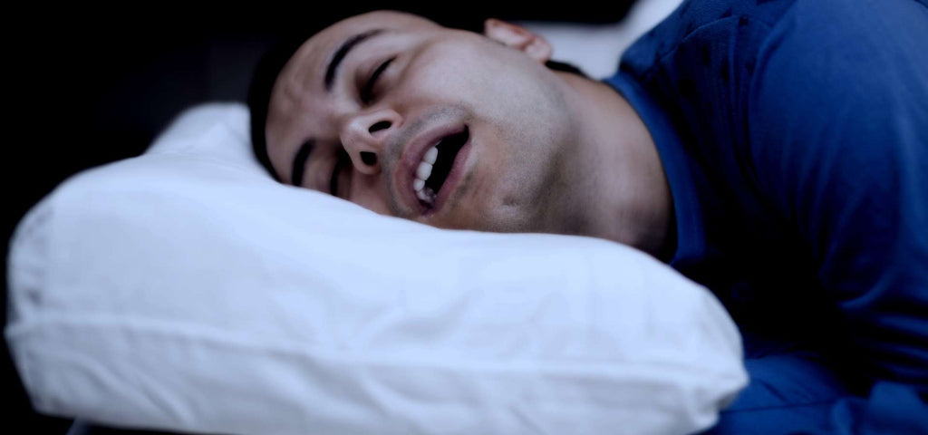 Man getting deep REM sleep with his mouth slightly open