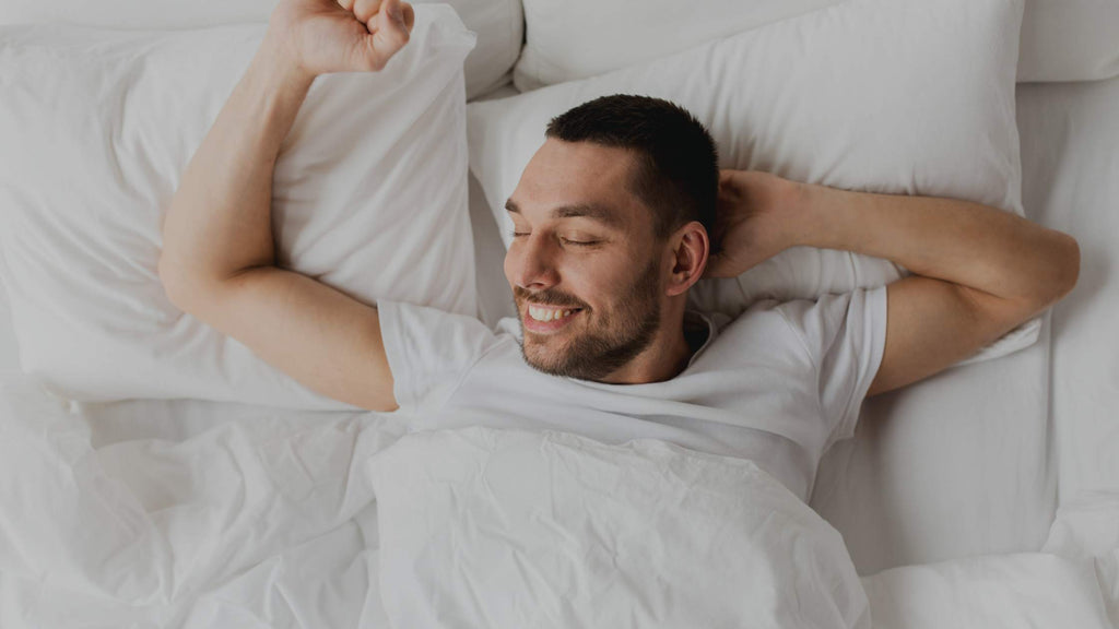 Man smiling as he is waking up