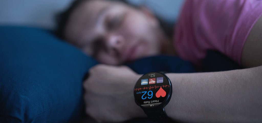 Woman sleeping while wearing a sleep tracker