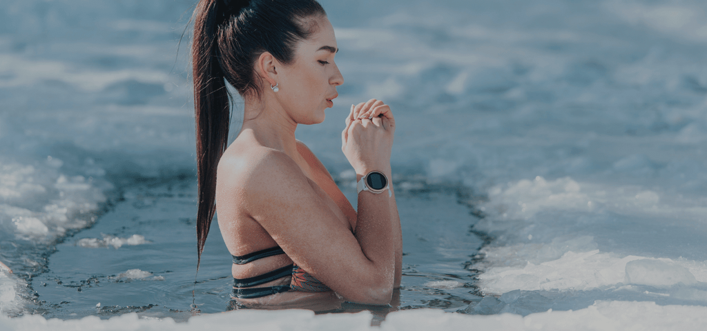 Woman counting down time in a outdoor ice plunge