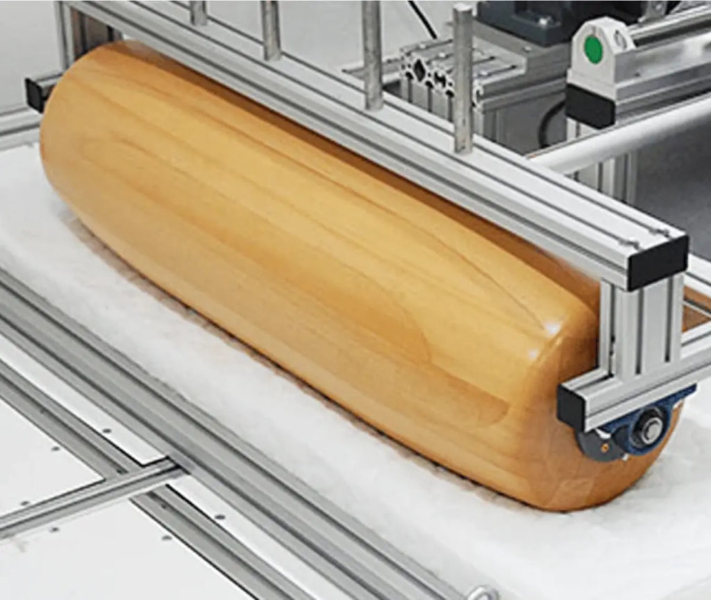 Large wooden roller testing Essentia foam.