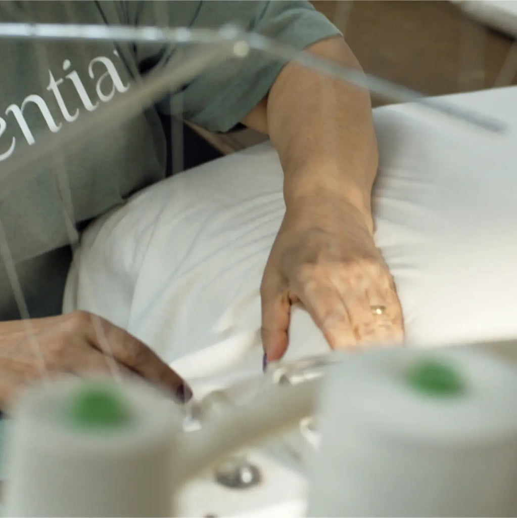 Essentia organic mattress being hand stitched at factory.