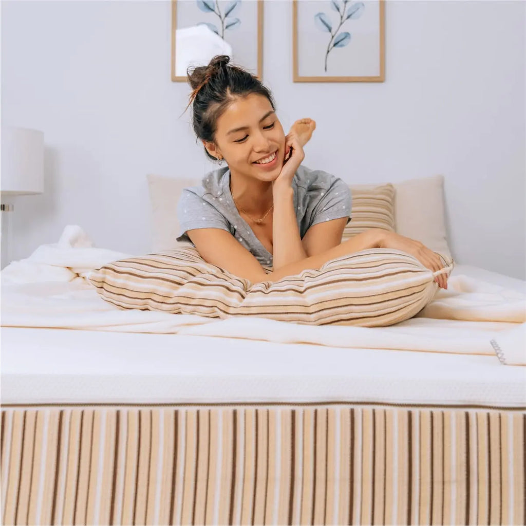 rem5_Essentia_organic_mattress_being_enjoyed_by_young_woman