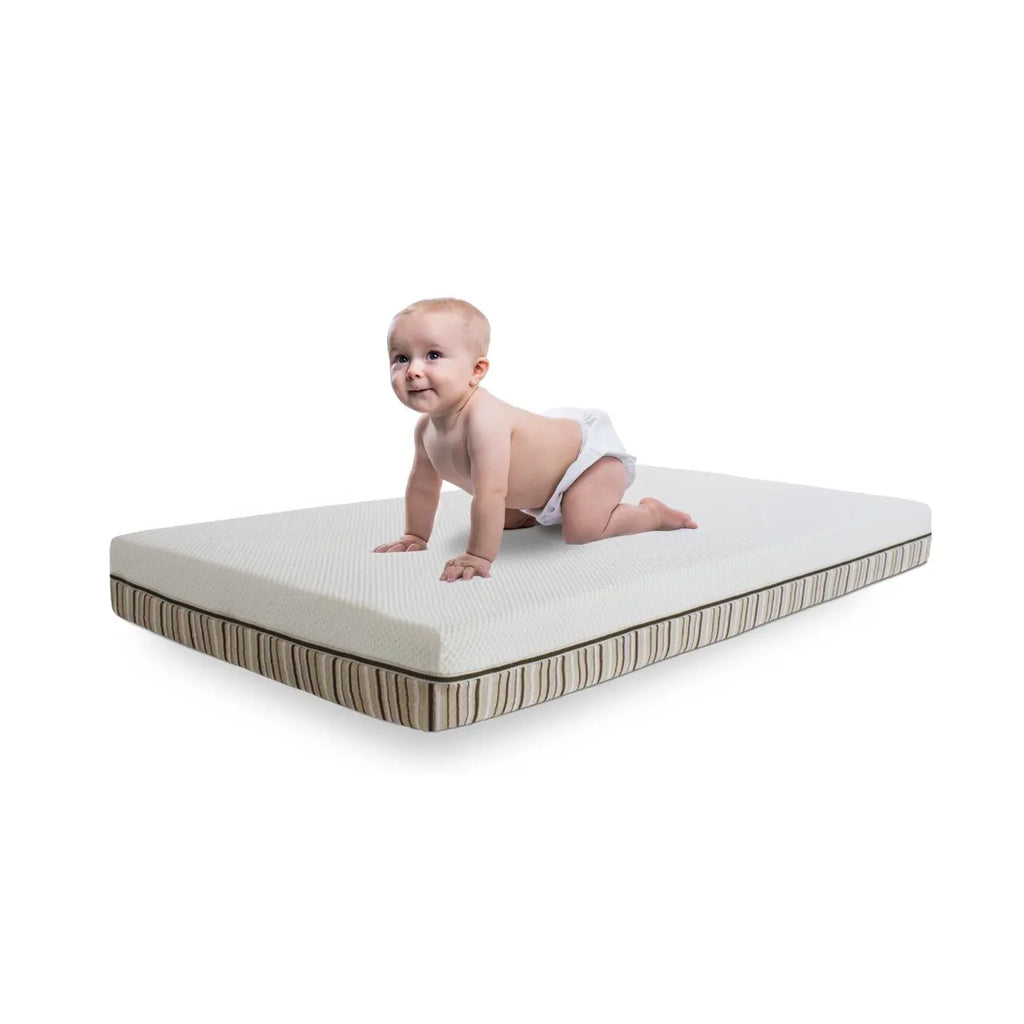 Isolated image of a baby crawling on an Essentia LaLa crib mattress